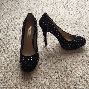 Black, gold studded heals.